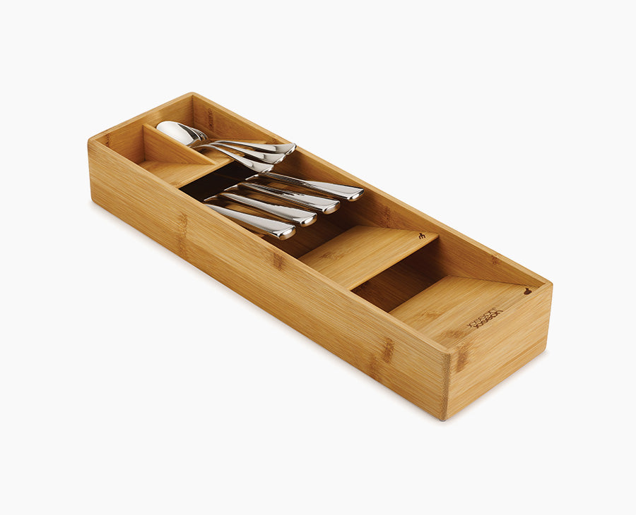 Joseph Joseph 85168. Compact bamboo silverware organizer with stacked compartments and example silverware.